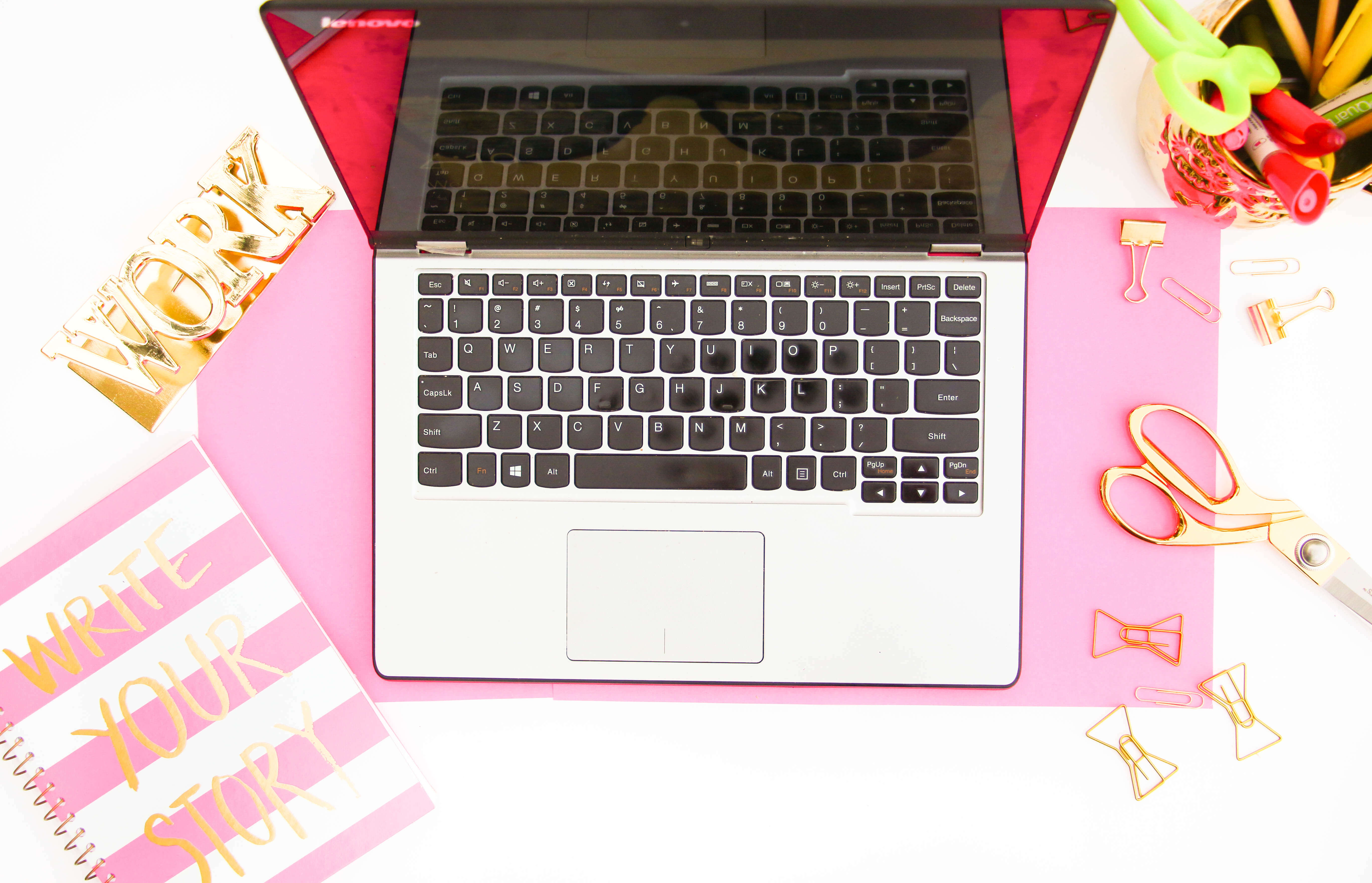 flatlay photo with notebook, laptop, scissors, dreams to reality