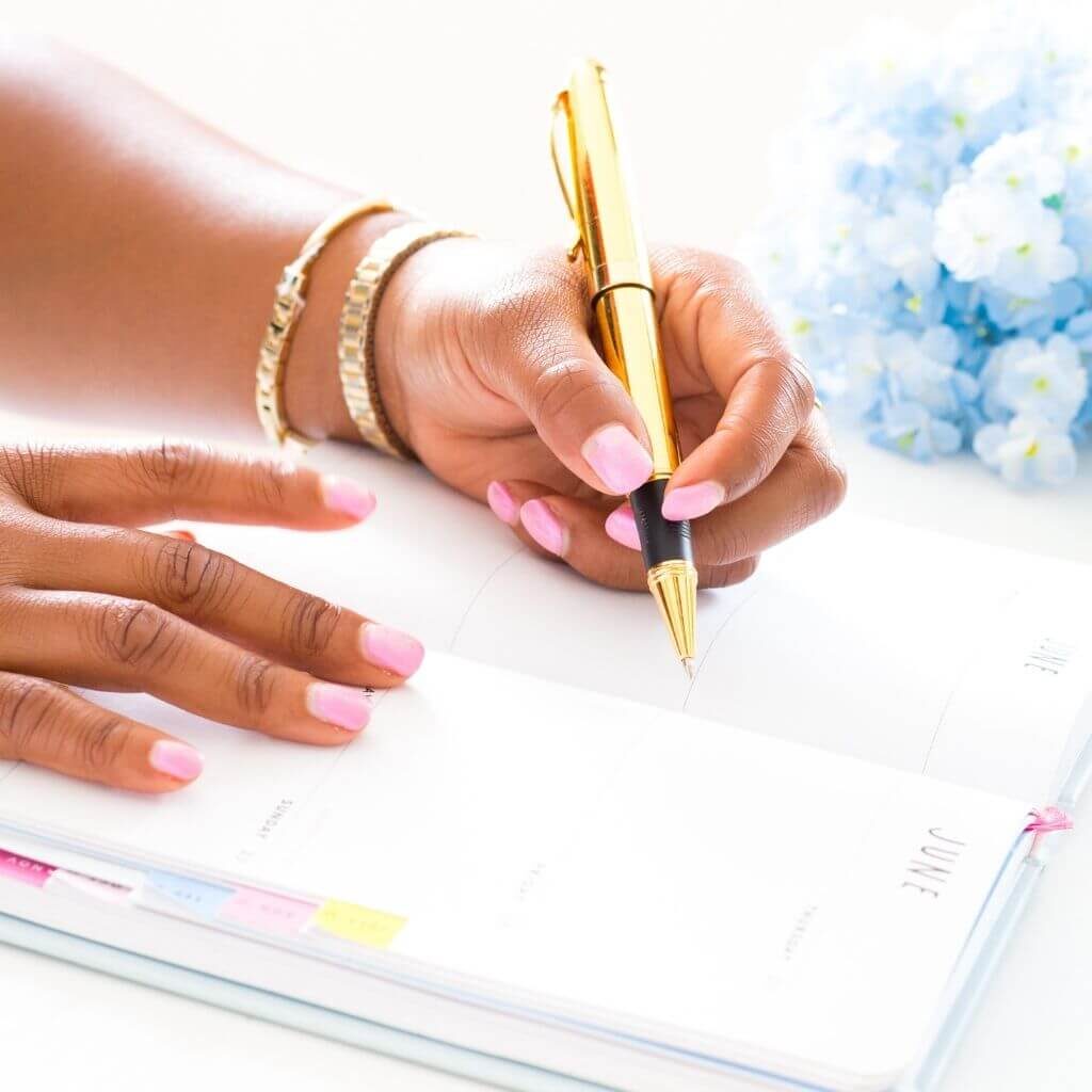 Woman writing in a journal