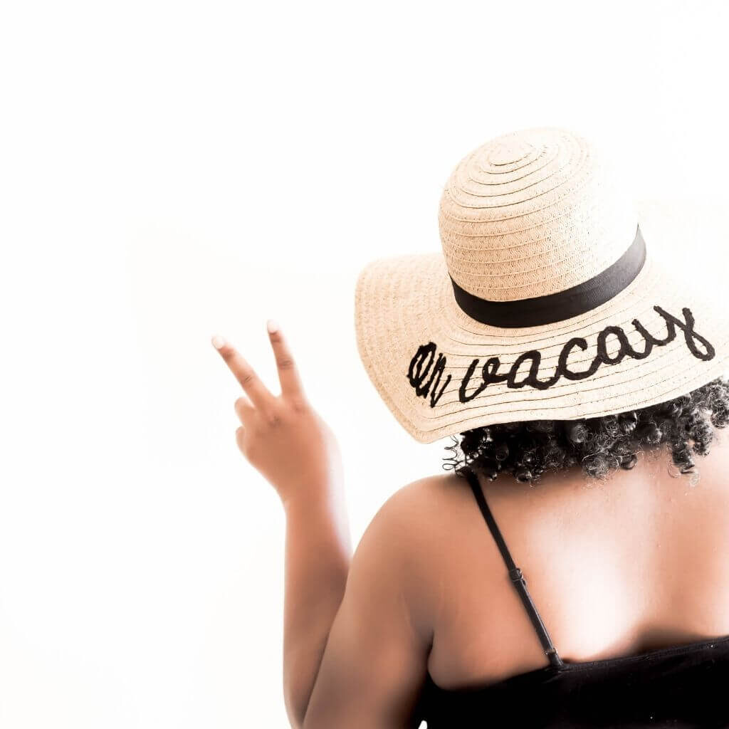 Woman in vacation with a peace sign